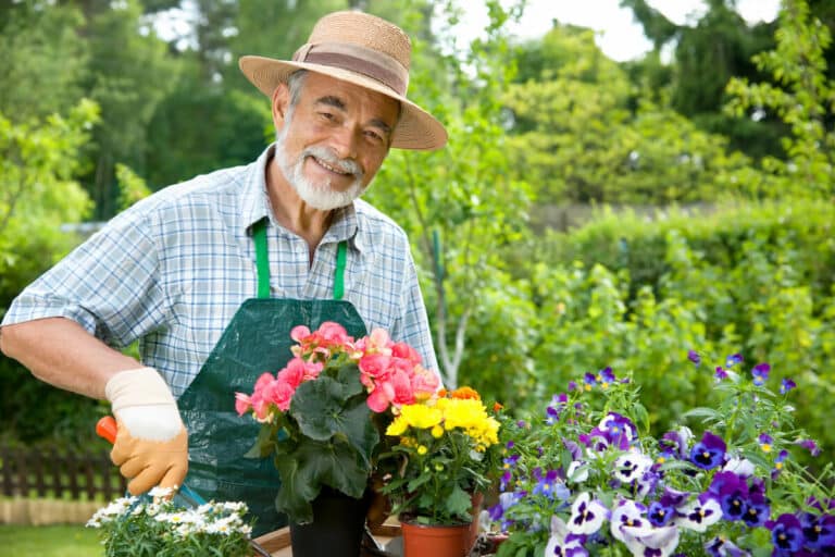 Barton House Memory Care | Senior man gardening