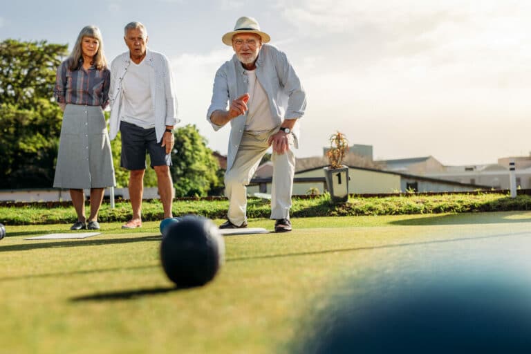 Barton House Memory Care | Seniors playing an outdoor game