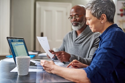 Barton House | Senior couple going over finances together