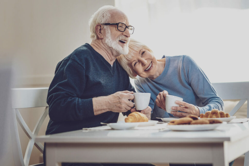 Camlu Assisted Living | Happy senior couple having coffee and smiling