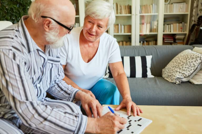 Novellus Cypresswood | Senior couple doing a crossword puzzle