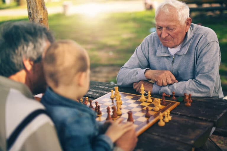 Novellus Cypresswood | Senior man playing a game of chess