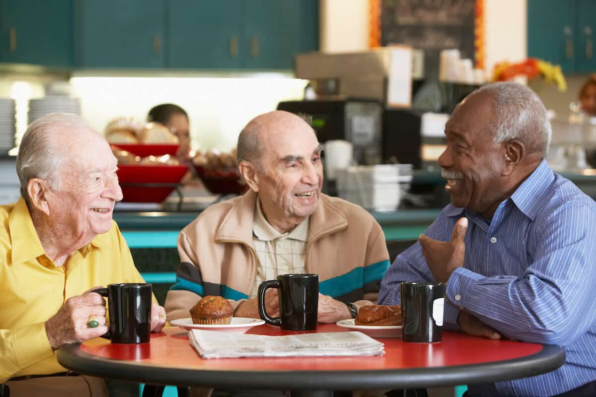 Novellus Cypresswood | Senior men having coffee and socializing