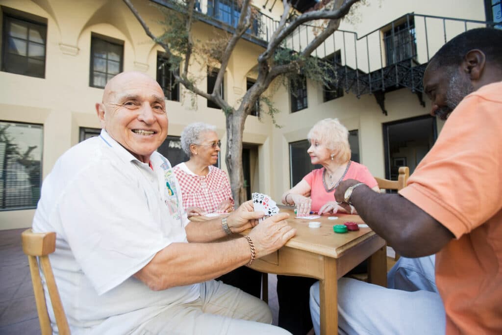 Novellus Cypresswood | Group of seniors playing cards