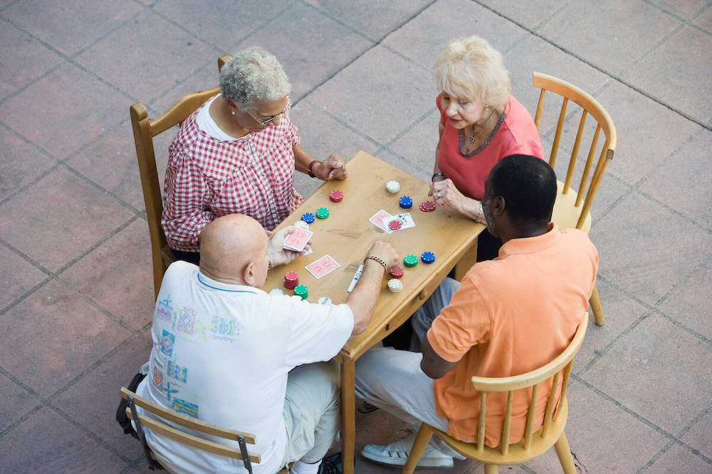 Novellus Kingwood | Group of seniors playing poker