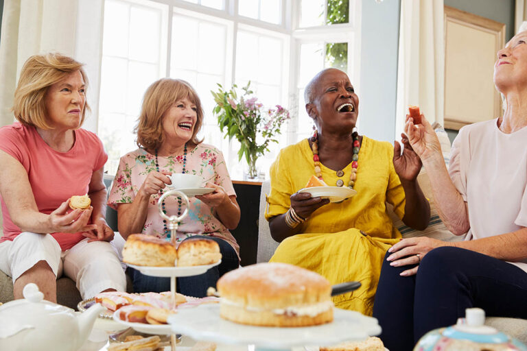Novellus Kingwood | Senior Female Friends Enjoying Afternoon Tea At Home Together