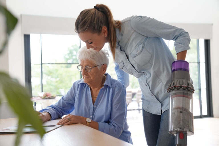 Novellus Kingwood | Elderly woman at home with homehelp doing household chores