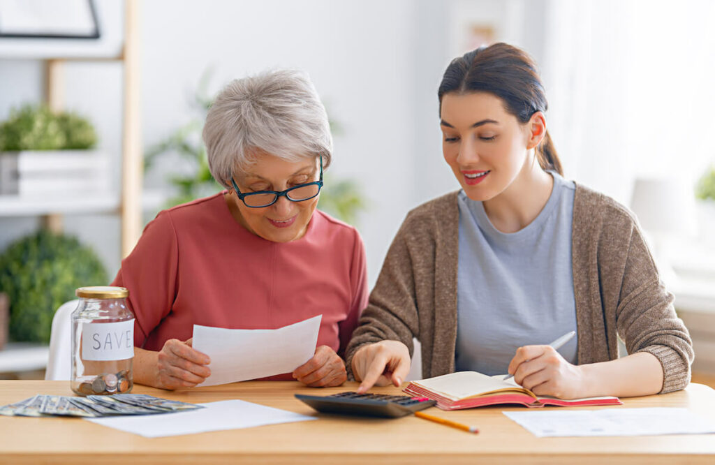 Orangeburg | Senior woman doing her financials with a profeessional