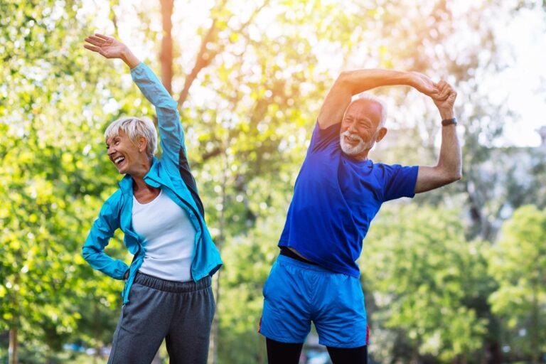 Orangeburg Memory Care | Happy fit senior couple exercising in park