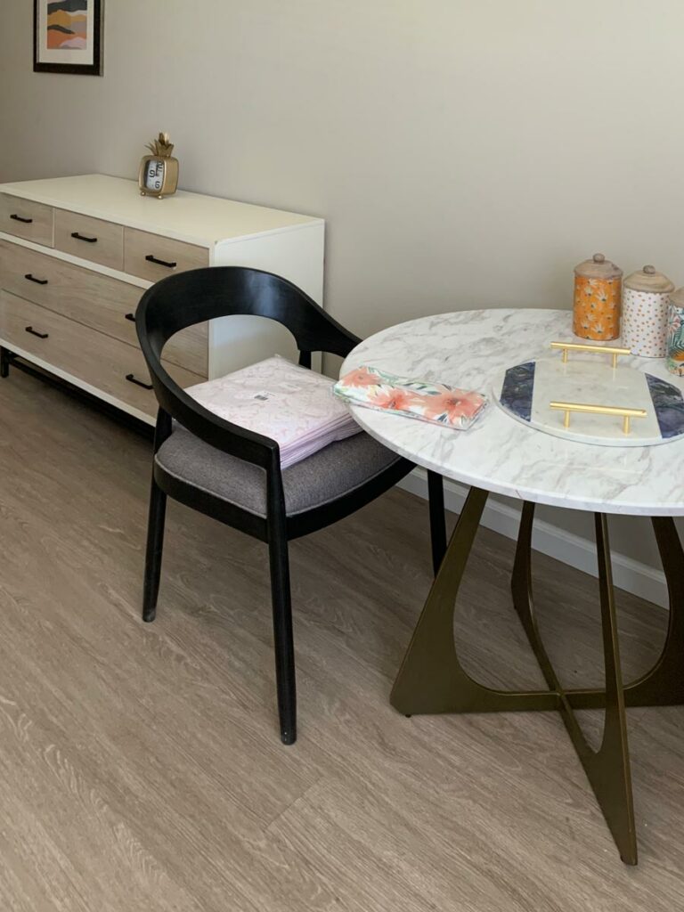 Novellus Stockton Assisted Living | Table and dresser of studio apartment