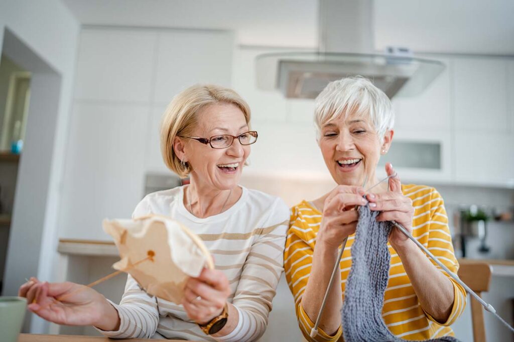 Stockton Assisted Living | Two seniors crafting together at the Stockton senior center