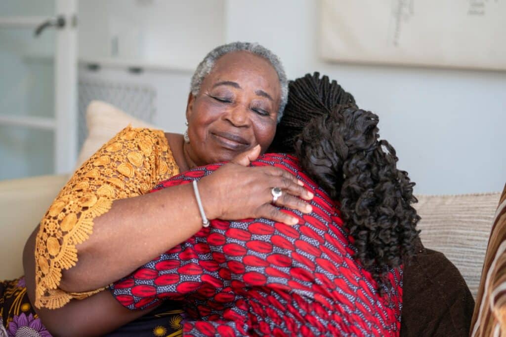 Stockton Assisted Living | Senior woman and caregiver hugging