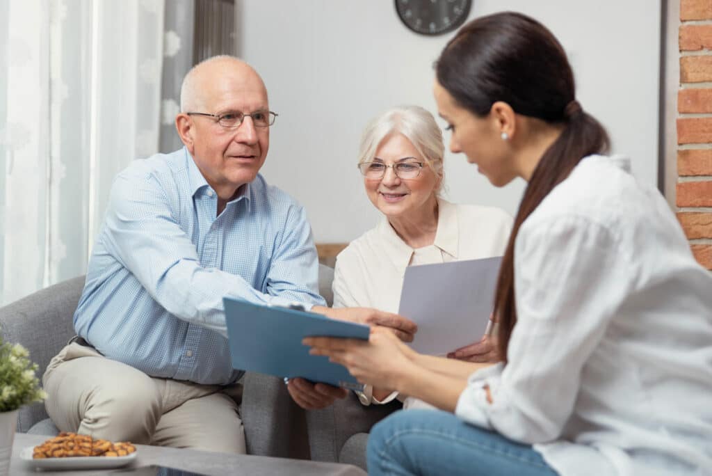 Novellus Living | Associate explaining to seniors