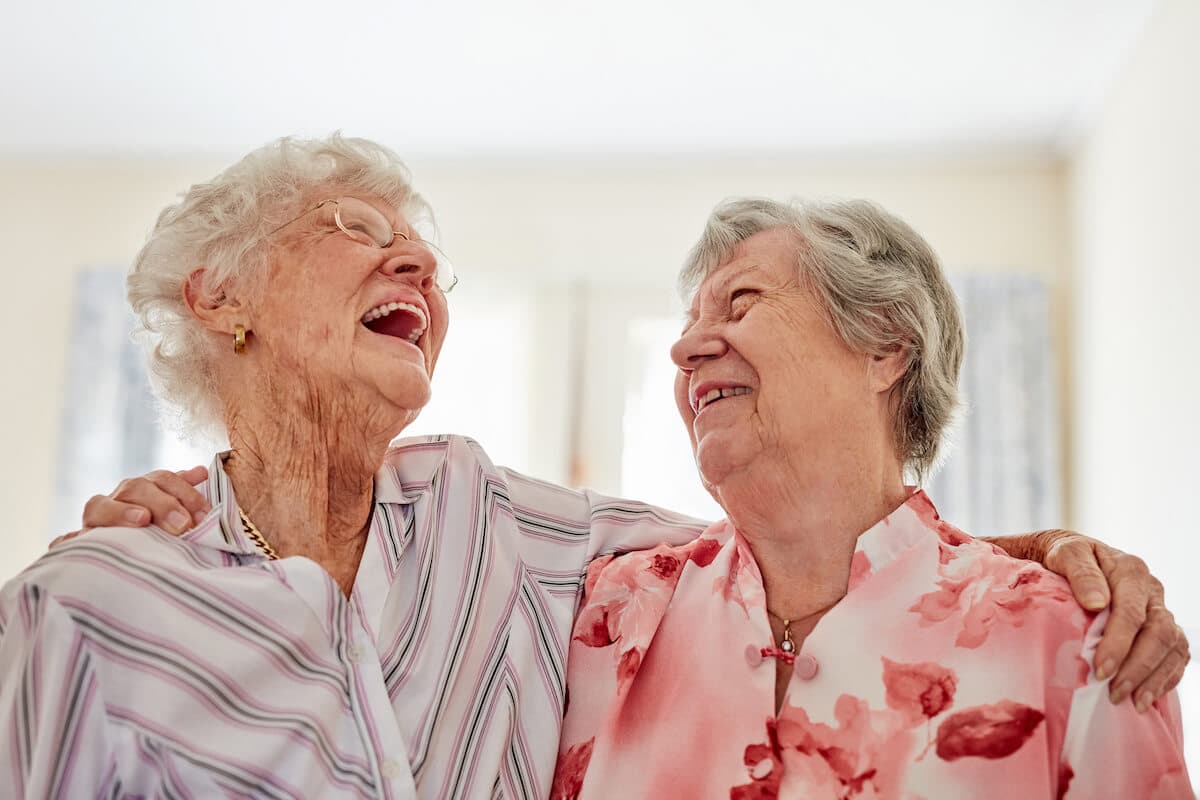 Cherry Creek | Two senior woman laughing together