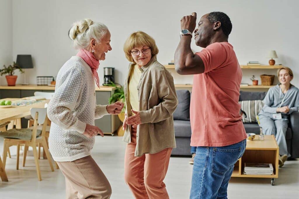 Orangeburg Memory Care | Happy seniors having a dance party