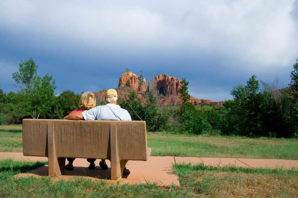 Barton House | Senior couple on park bench looking at rock formation