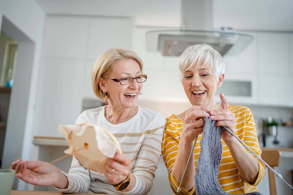 Camlu Assisted Living | Two seniors crafting together at the Stockton senior center