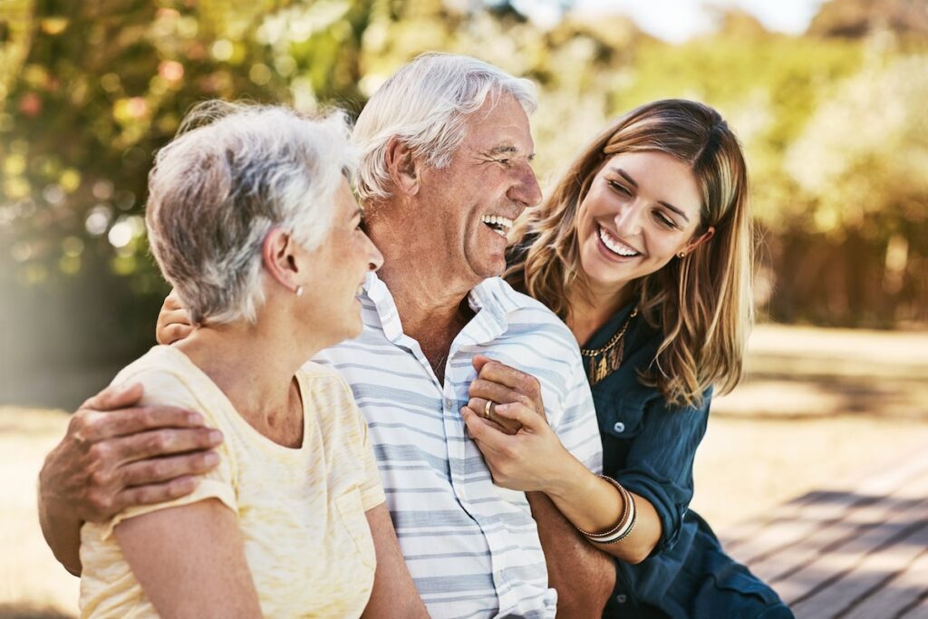 Orangeburg | Daughter and senior parents laughing outside