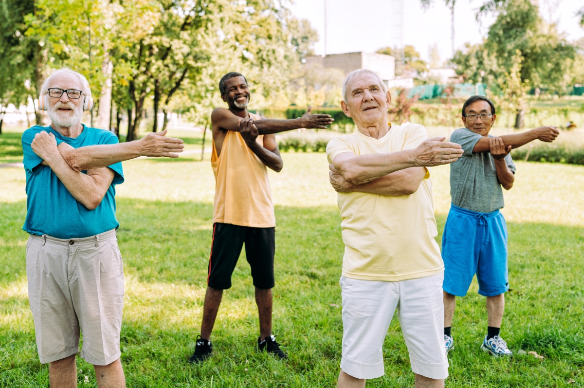 Kingwood | Group of seniors exercising in the park