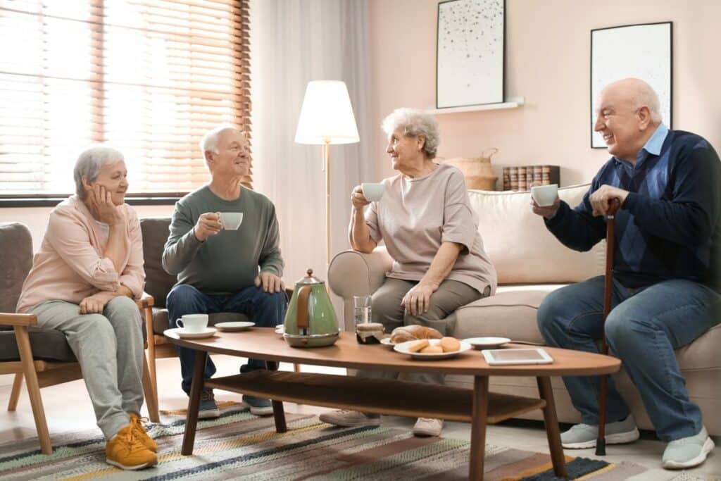 Camlu | Group of seniors sitting in a living room