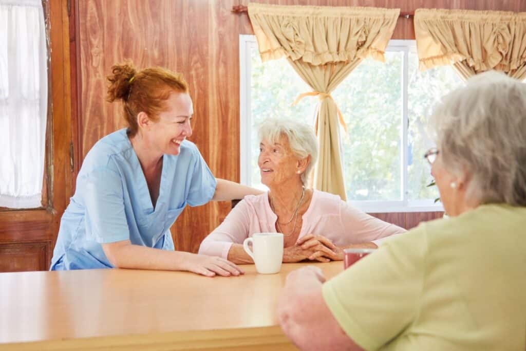 Cherry Creek | Senior woman and caretaker laughing together